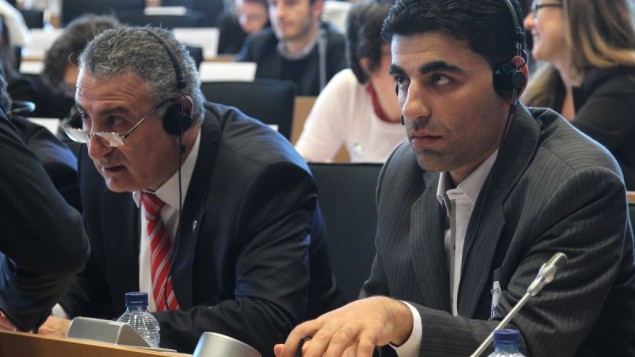 Kamal Al-Labwani (left), attends a meeting at the European Parliament in Brussels, June 2012 (photo credit: AP/Yves Logghe)
