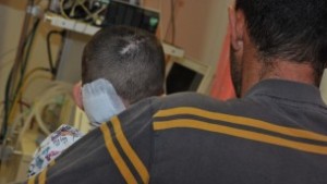 A wounded Syrian child and her father at the Western Galilee Hospital in Nahariya, March 11, 2014 (photo credit: courtesy/Western Galilee Hospital)